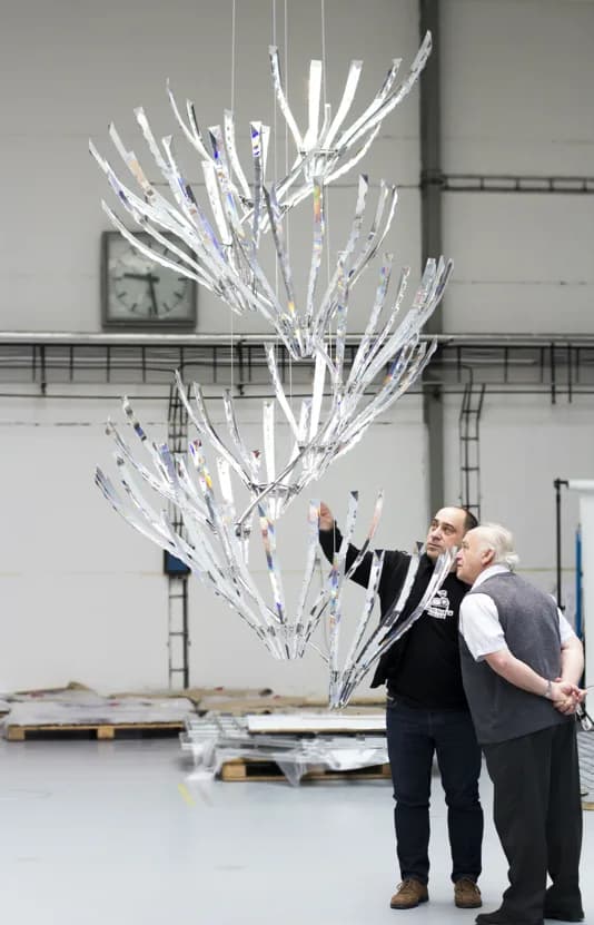 Jaroslav Bejvl Jr. and Sr. reviewing a crystal light installation in the assembly hall